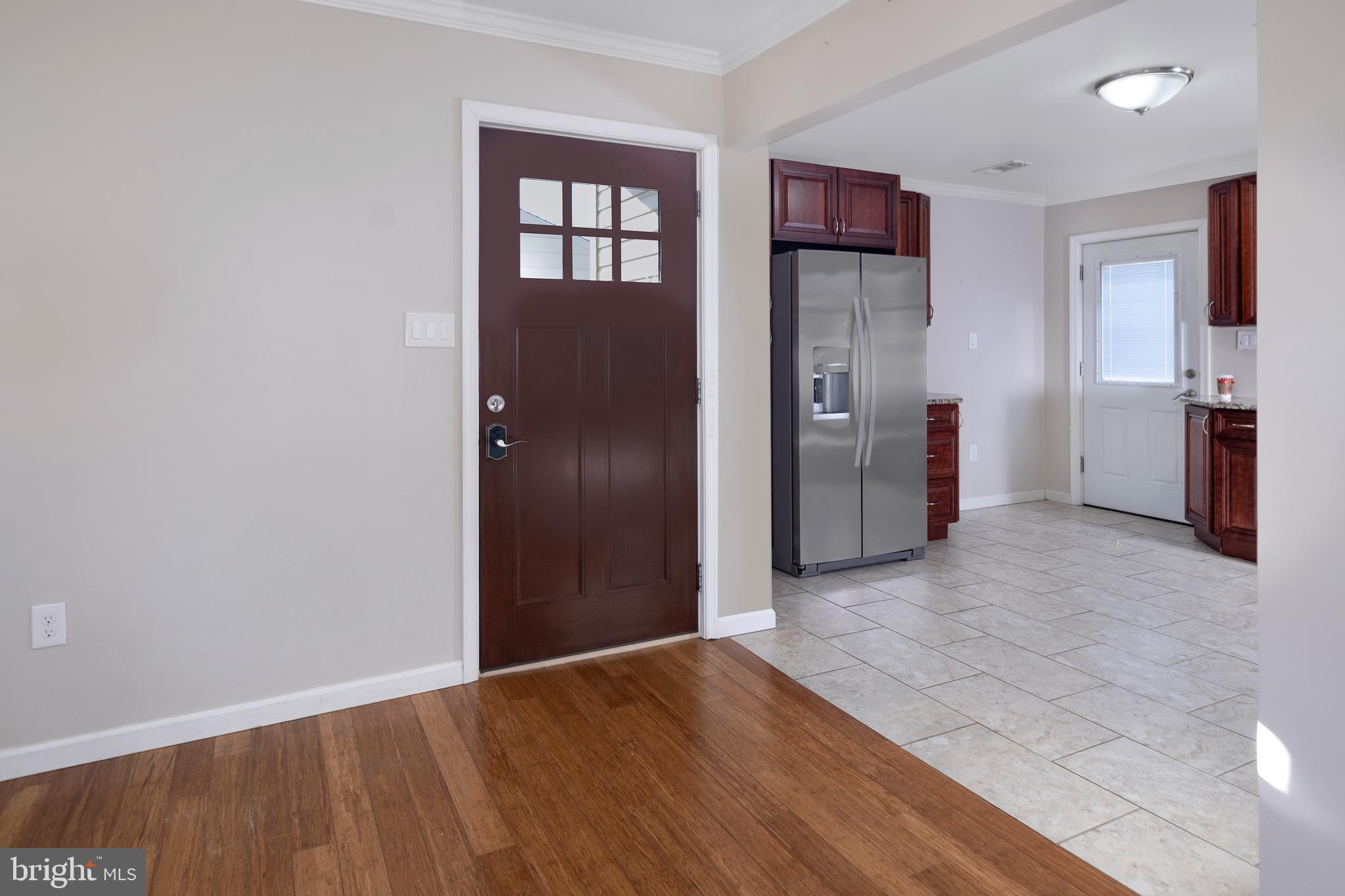 33 Gilmore Road Ewing, NJ 08628 - Photo 6 of 21 a view of a kitchen with refrigerator and wooden floor