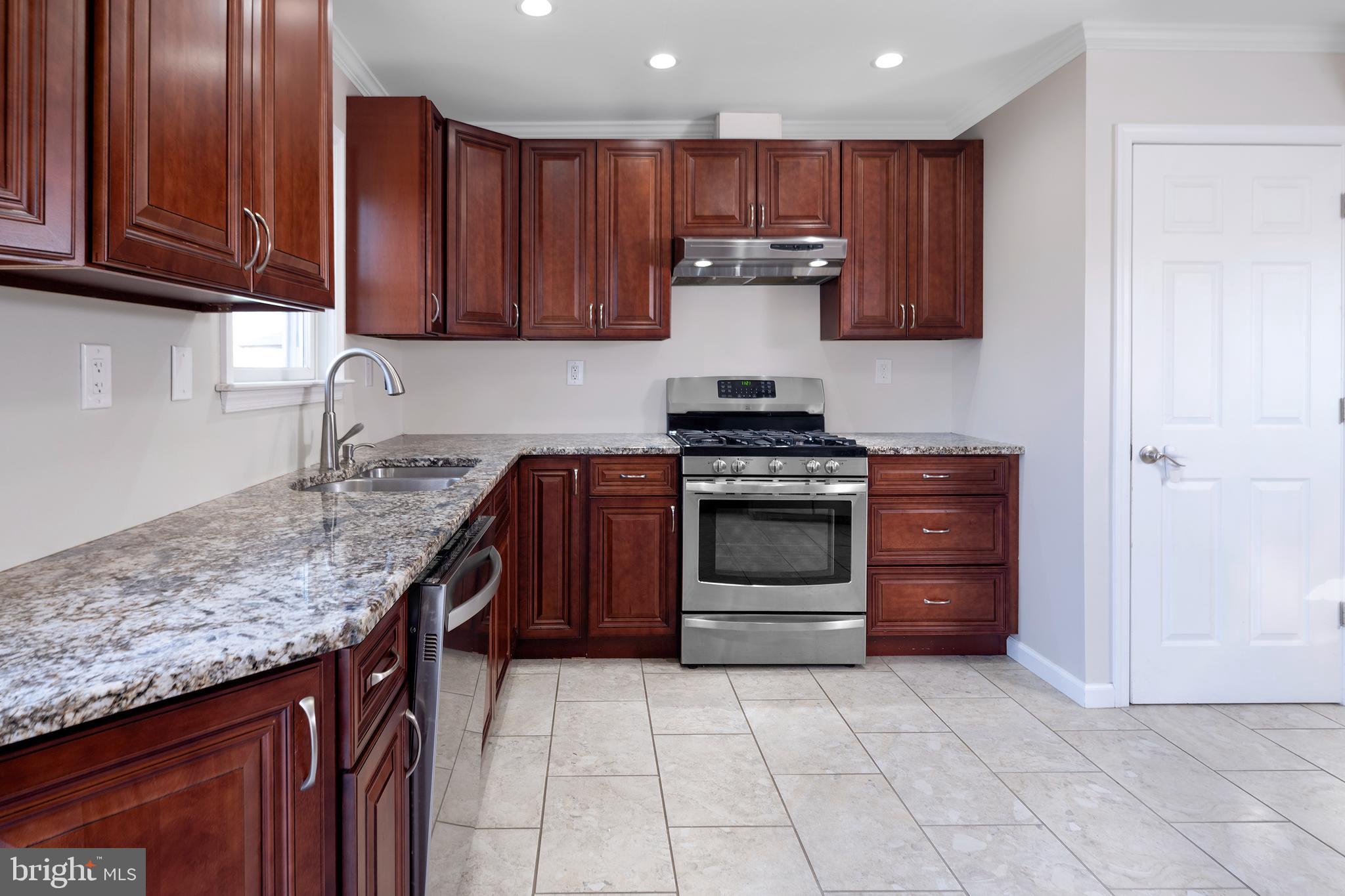 33 Gilmore Road Ewing, NJ 08628 - Photo 7 of 21 a kitchen with stainless steel appliances granite countertop a stove and a cabinets