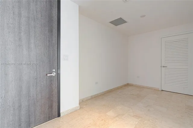 a bathroom with a sink a mirror and a shower