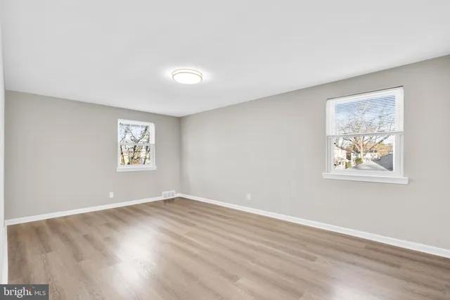 an empty room with windows