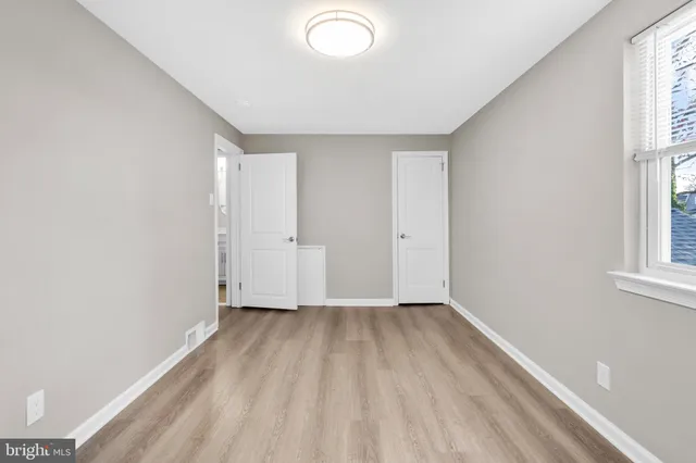 a view of a backyard with wooden fence