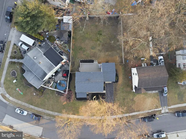an aerial view of a house with yard