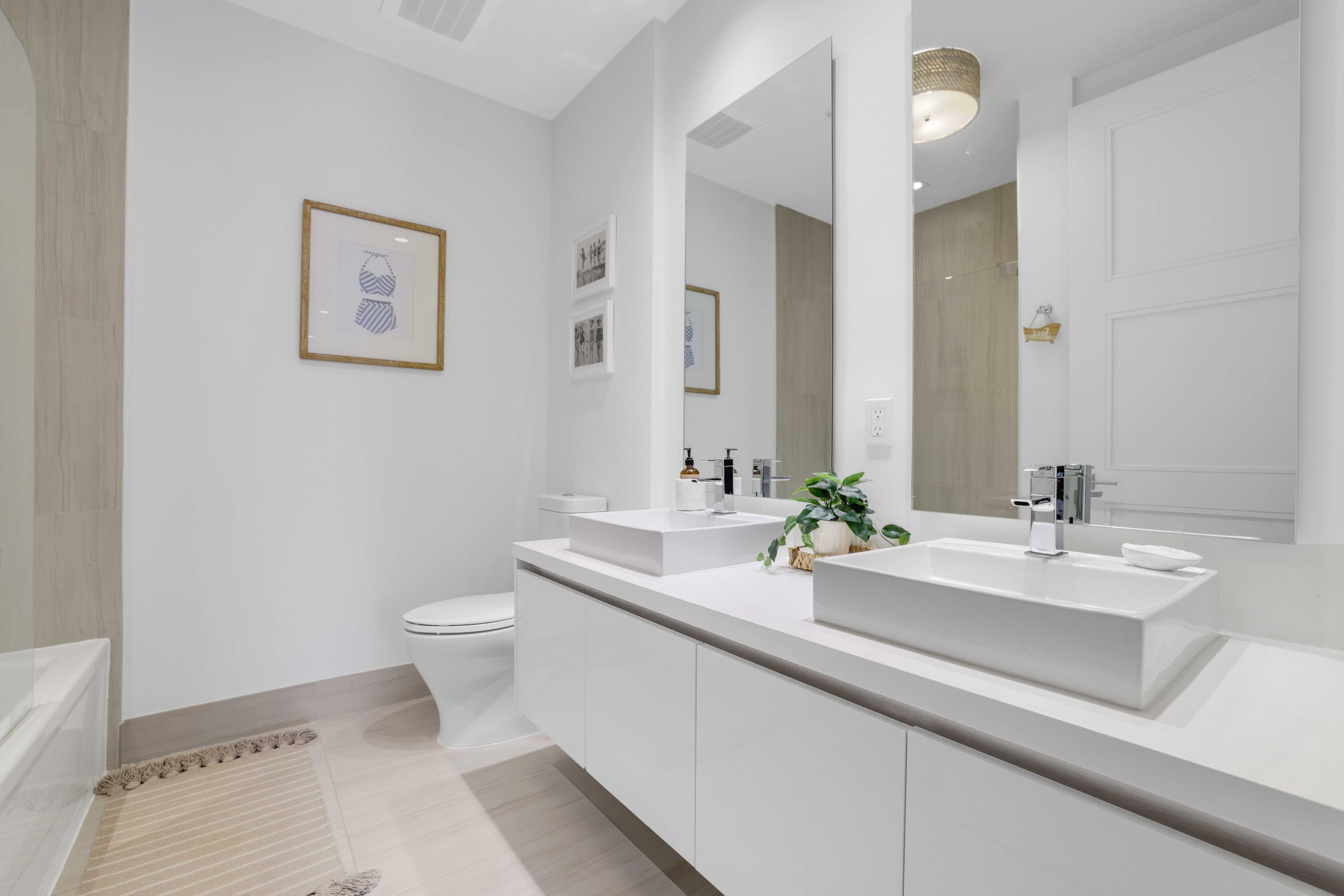 155 East Boca Raton Road, Unit 601 Boca Raton, FL 33432 - Photo 23 of 55 a bathroom with a sink and a mirror