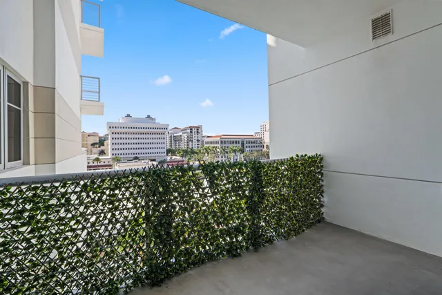 an aerial view of residential houses with outdoor space and parking
