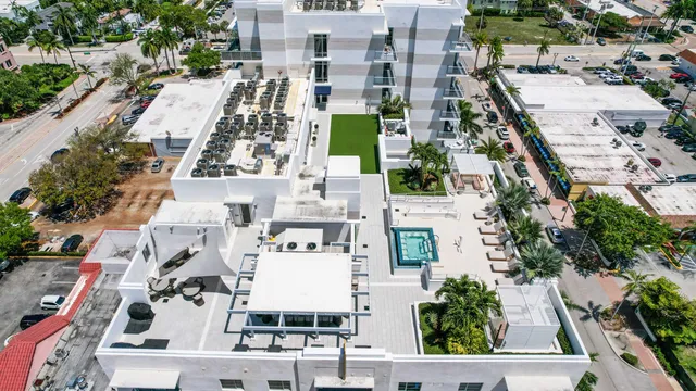 a view of a patio with dining table and chairs with yard
