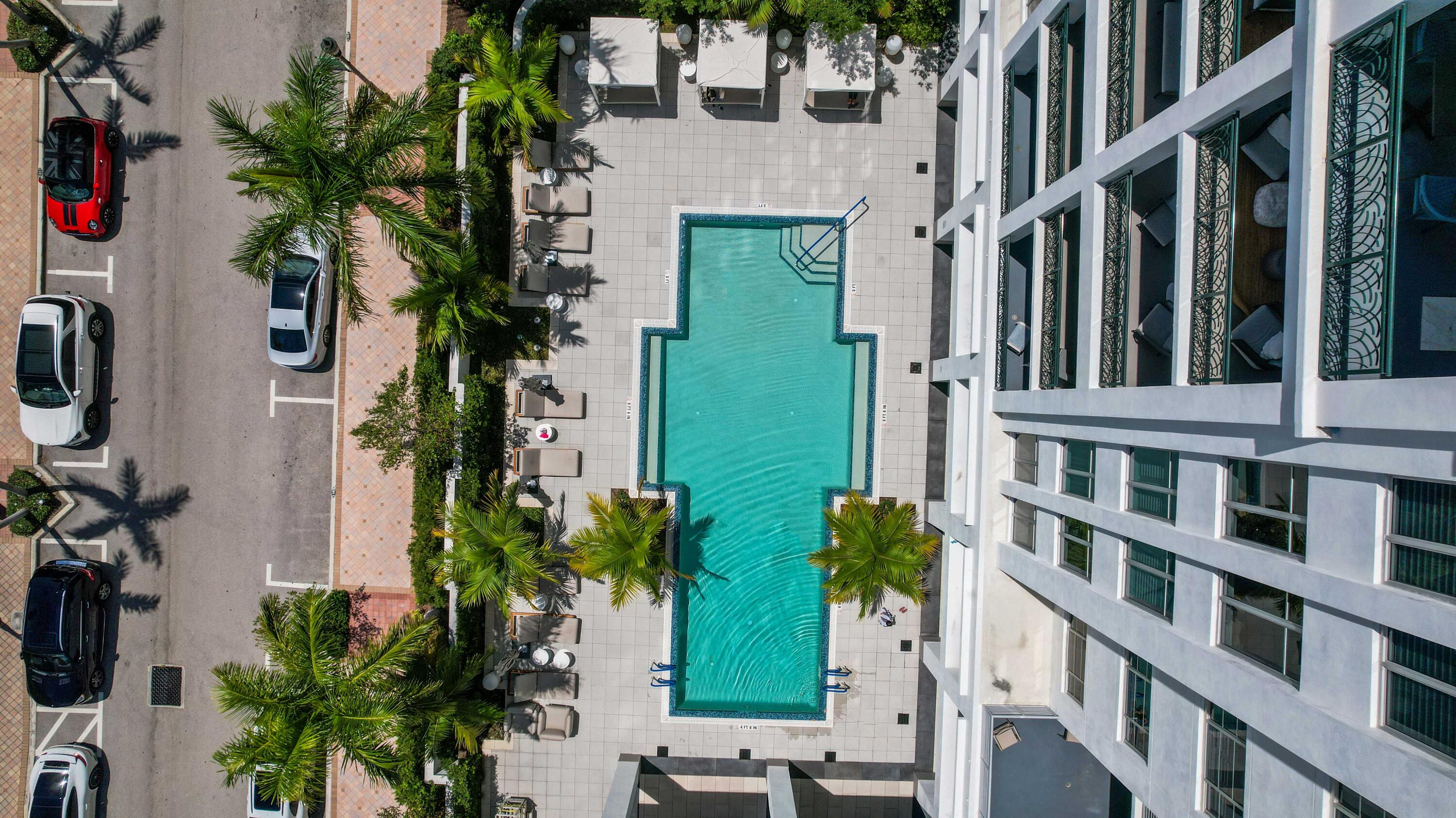155 East Boca Raton Road, Unit 601 Boca Raton, FL 33432 - Photo 53 of 55 a front view of a house with a tree