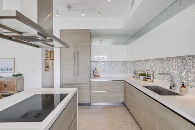 a kitchen with a sink stainless steel appliances and cabinets