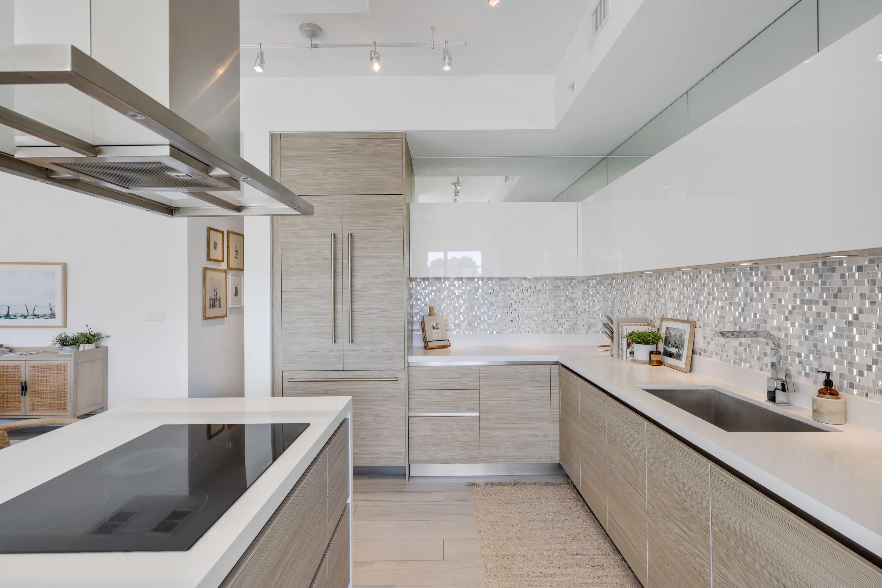 155 East Boca Raton Road, Unit 601 Boca Raton, FL 33432 - Photo 8 of 55 a kitchen with a sink stainless steel appliances and cabinets