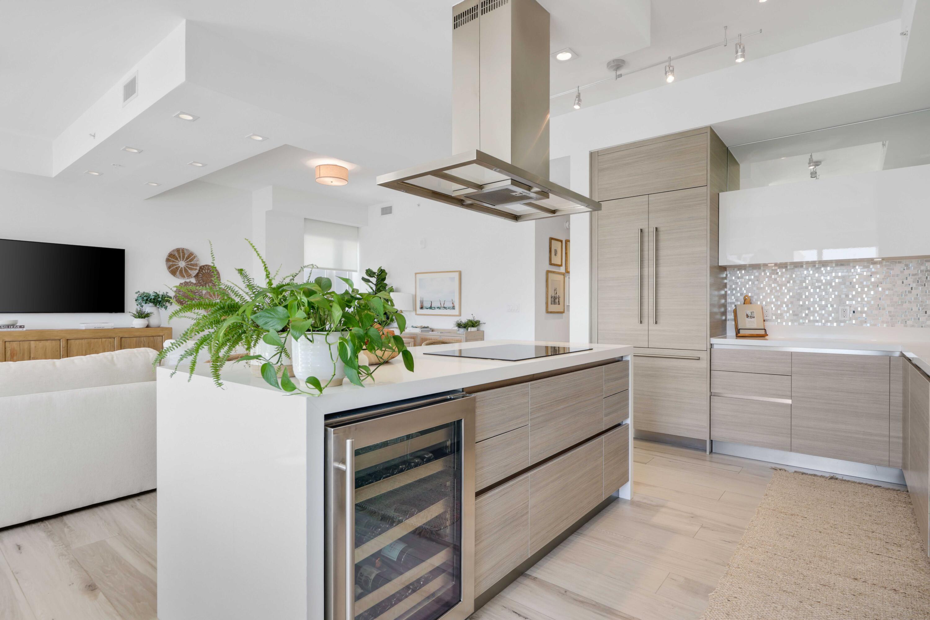155 East Boca Raton Road, Unit 601 Boca Raton, FL 33432 - Photo 9 of 55 a kitchen with stainless steel appliances kitchen island granite countertop a sink a counter space and cabinets