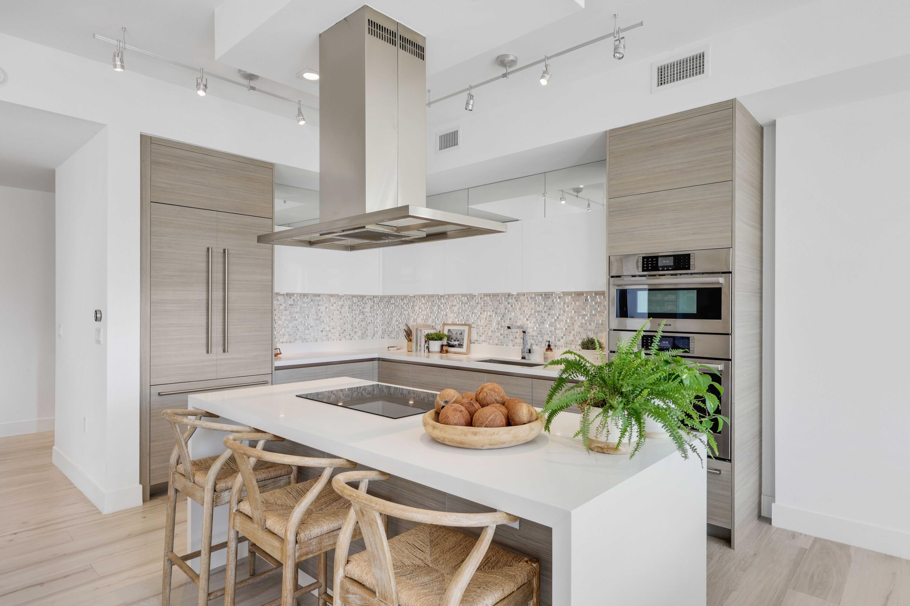 155 East Boca Raton Road, Unit 601 Boca Raton, FL 33432 - Photo 10 of 55 a kitchen with a table and chairs in it