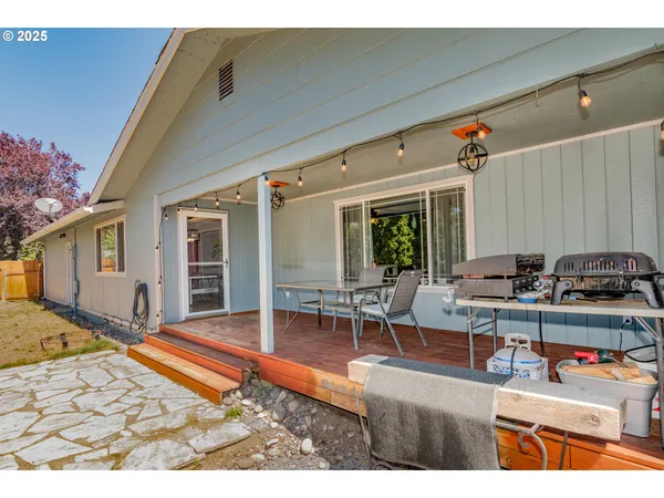 a view of a backyard with sitting area