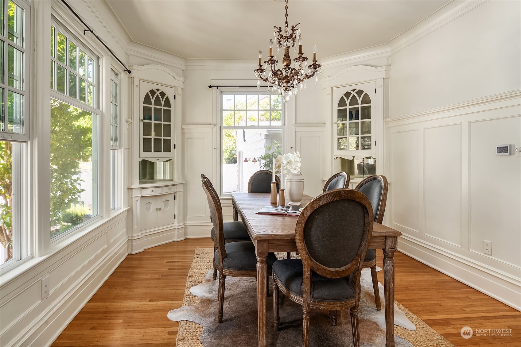 1505 North 43rd Street Seattle, WA 98103 - Photo 11 of 40 a dining room with furniture a chandelier and wooden floor