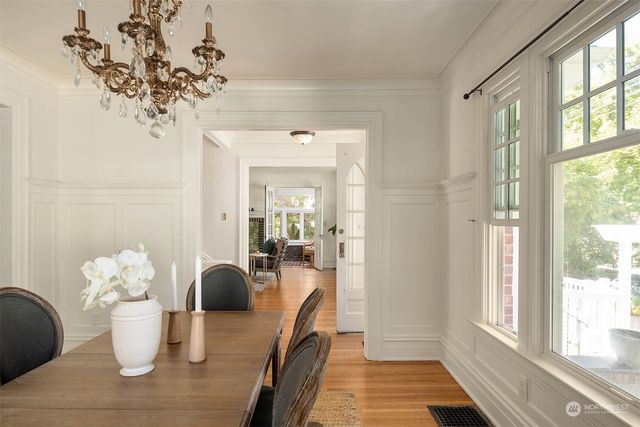 a kitchen with stainless steel appliances granite countertop a stove a sink and white cabinets