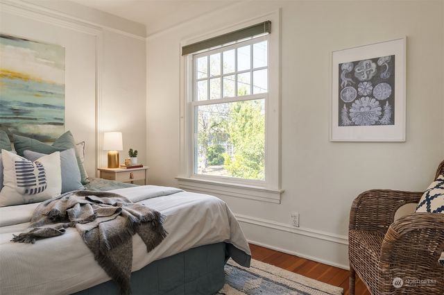 a view of an entrance to house with yard and green space