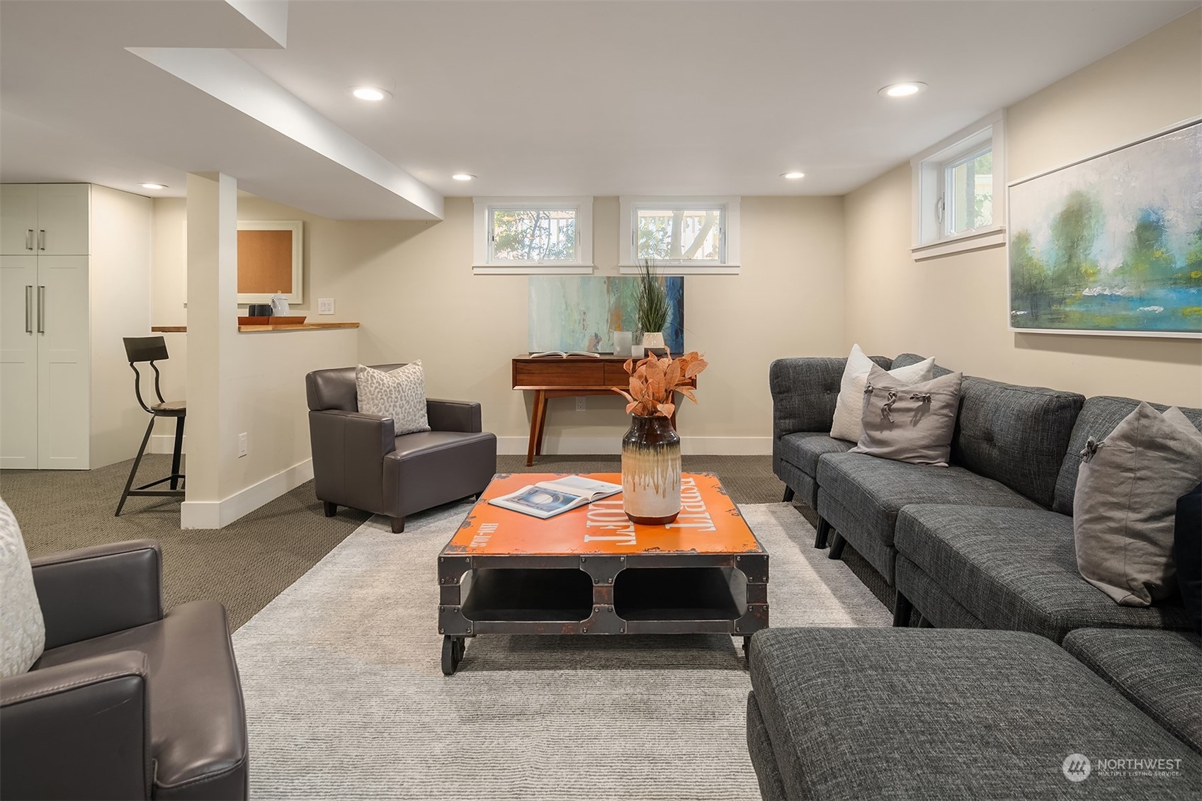 1505 North 43rd Street Seattle, WA 98103 - Photo 26 of 40 a living room with furniture a table and a flat screen tv