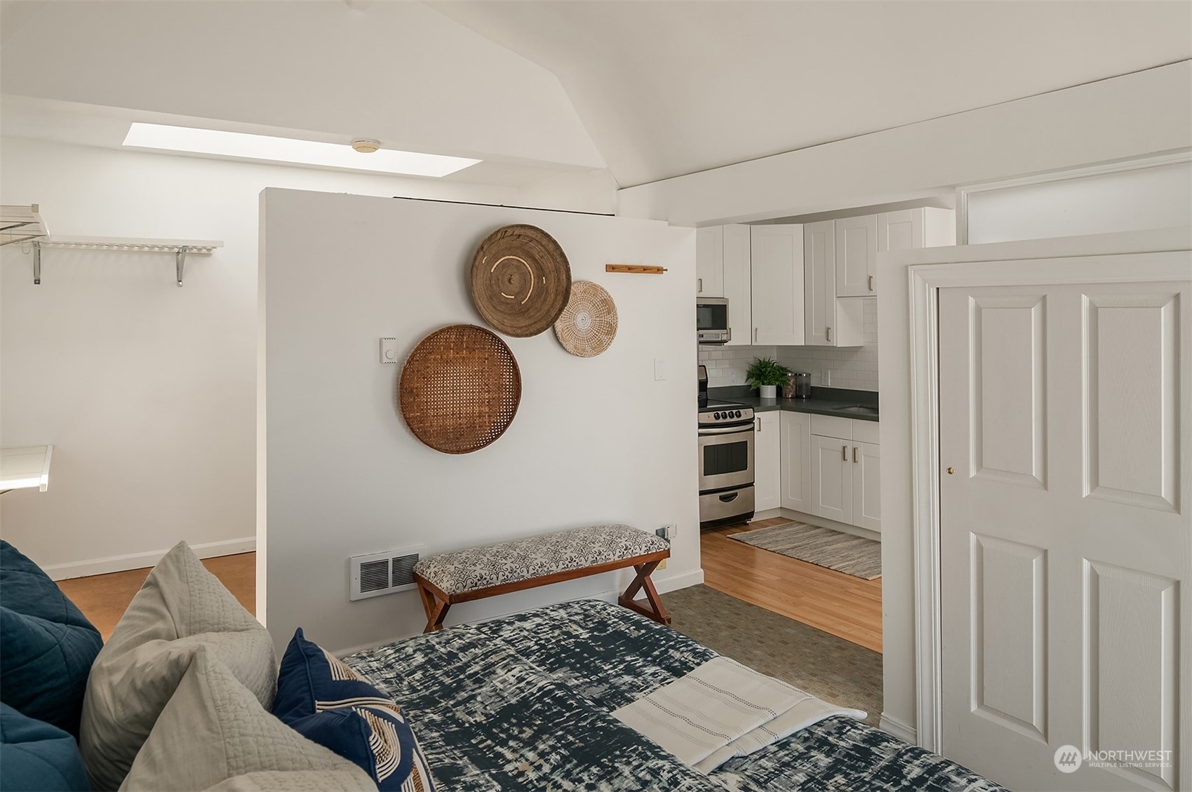 1505 North 43rd Street Seattle, WA 98103 - Photo 31 of 40 a bedroom with a bed and cabinets
