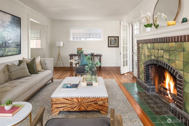 a living room with furniture a fireplace and a table