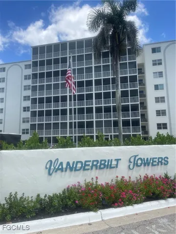 a front view of a building with parking space and parking space