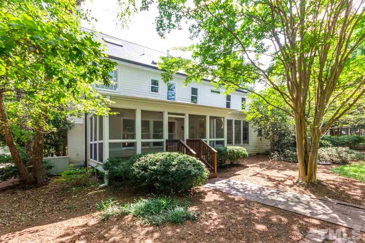3424 Doyle Road Raleigh, NC 27607 - Photo 24 of 25 a view of a house with a yard and potted plants