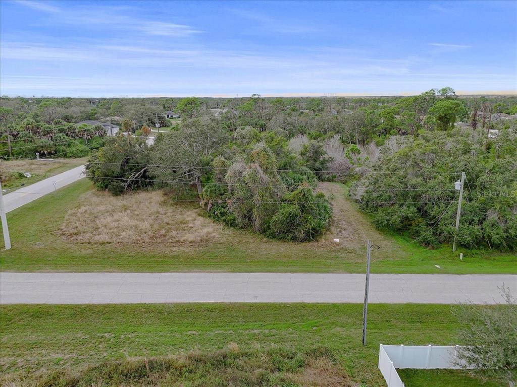 201 Hardee Way Rotonda West, FL 33947 - Photo 17 of 20 a view of a yard with an ocean