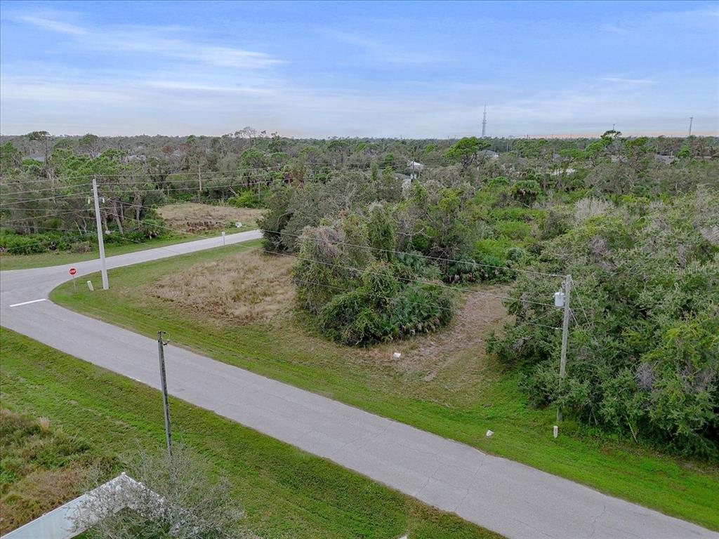 201 Hardee Way Rotonda West, FL 33947 - Photo 19 of 20 a view of a green field with clear sky