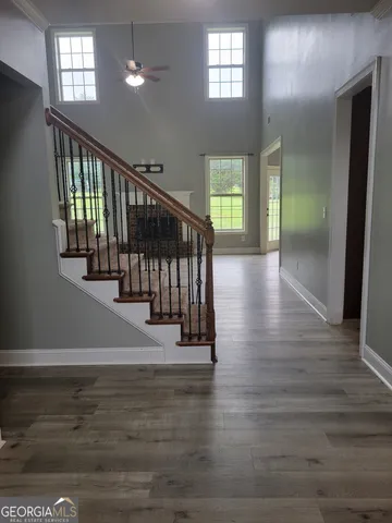 a view of entryway with stairs and wooden floor