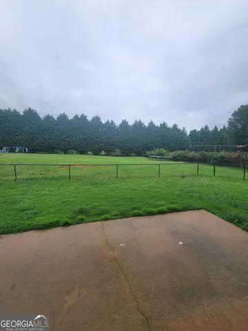 a view of a golf course with a lake