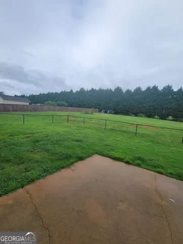 a view of a golf course with a lake