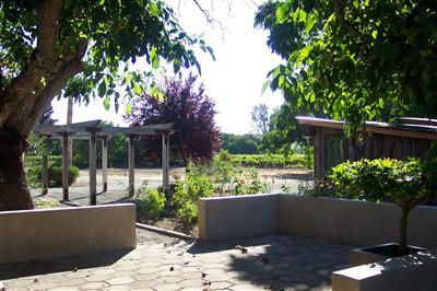 4193 Big Ranch Road Napa, CA 94558 - Photo 8 of 12 a view of a house with a yard and a garden