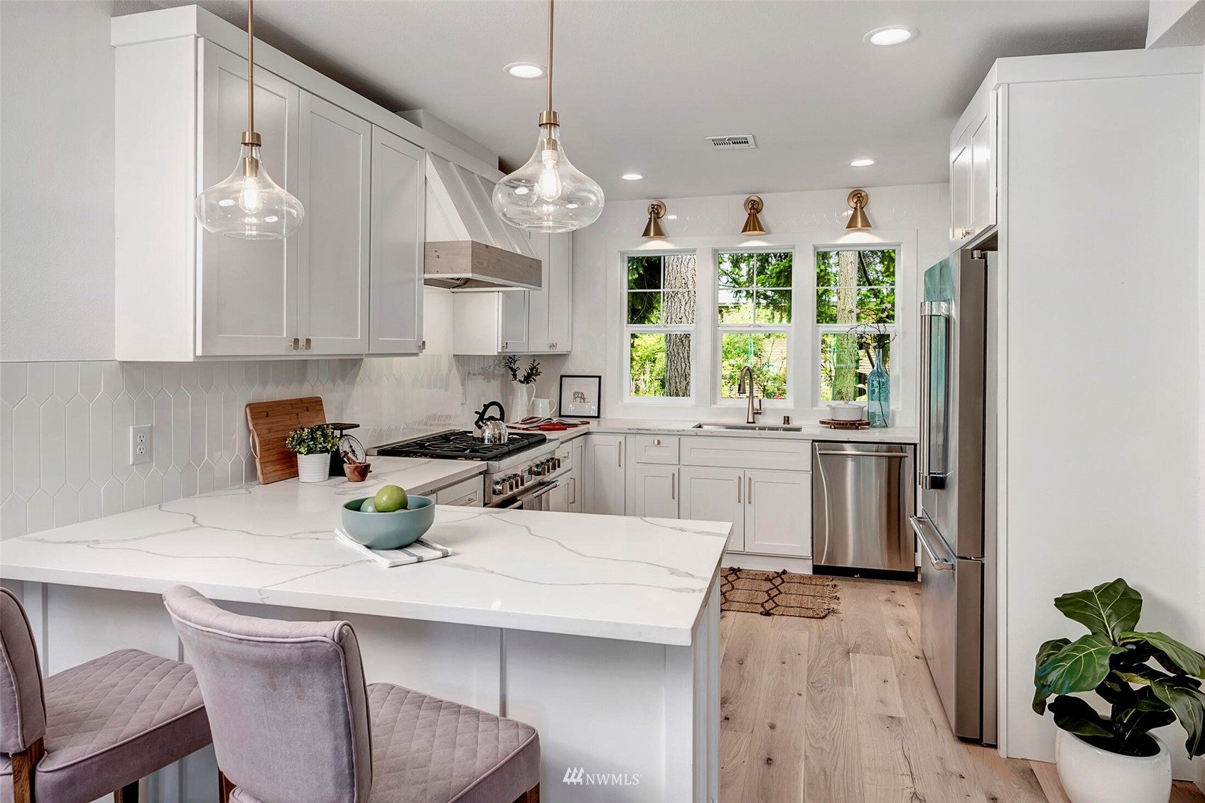 944 26th Avenue Seattle, WA 98122 - Photo 14 of 40 a kitchen with a sink a window and stainless steel appliances