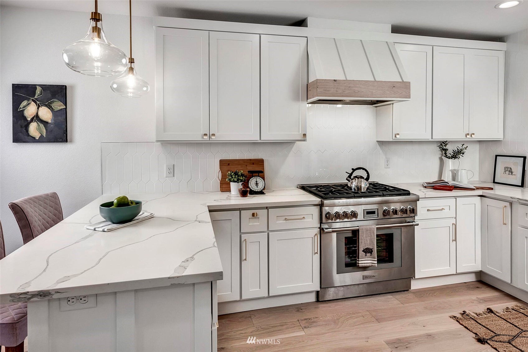 944 26th Avenue Seattle, WA 98122 - Photo 15 of 40 a kitchen with white cabinets and appliances