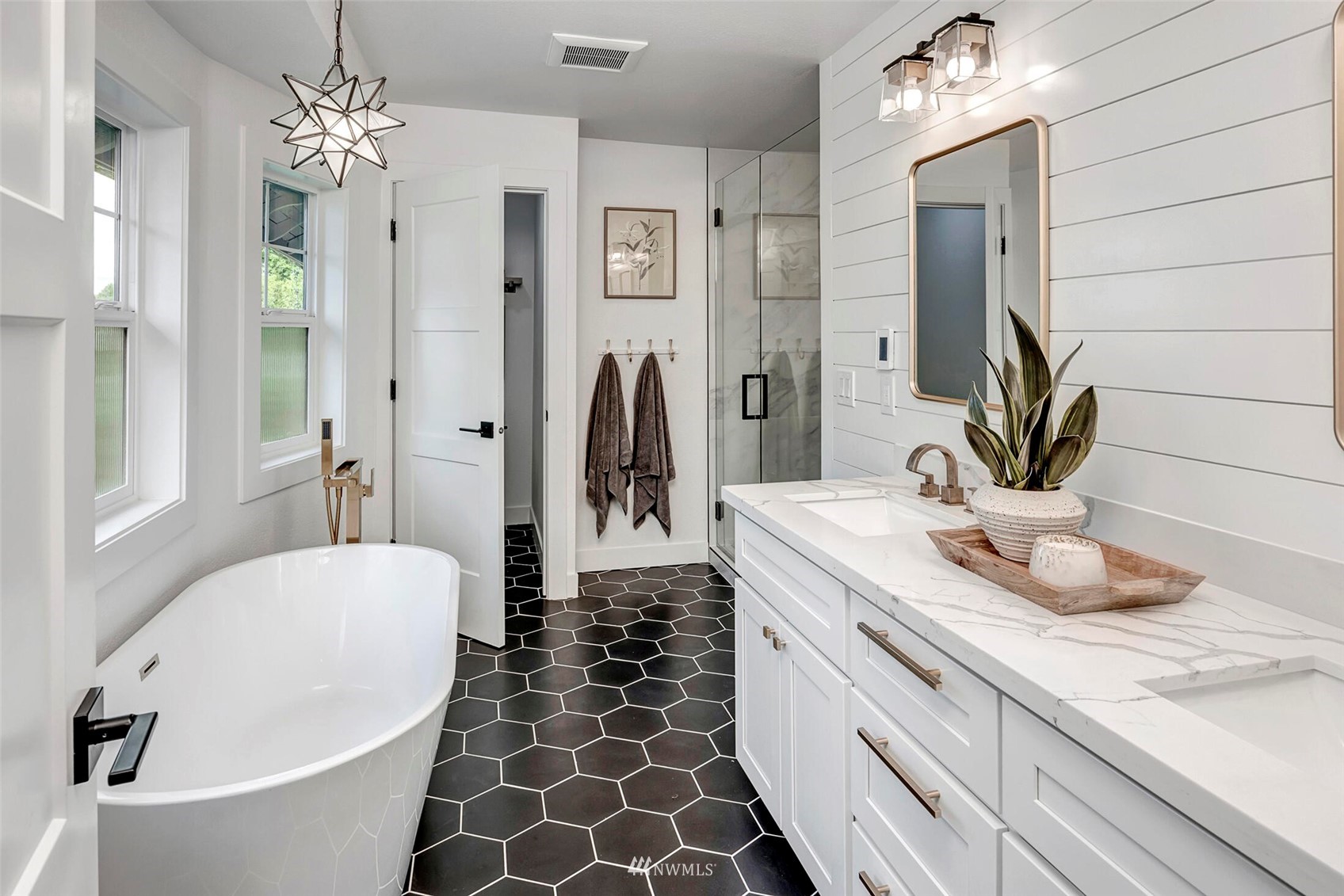 944 26th Avenue Seattle, WA 98122 - Photo 19 of 40 a bathroom with a double vanity sink and a bathtub