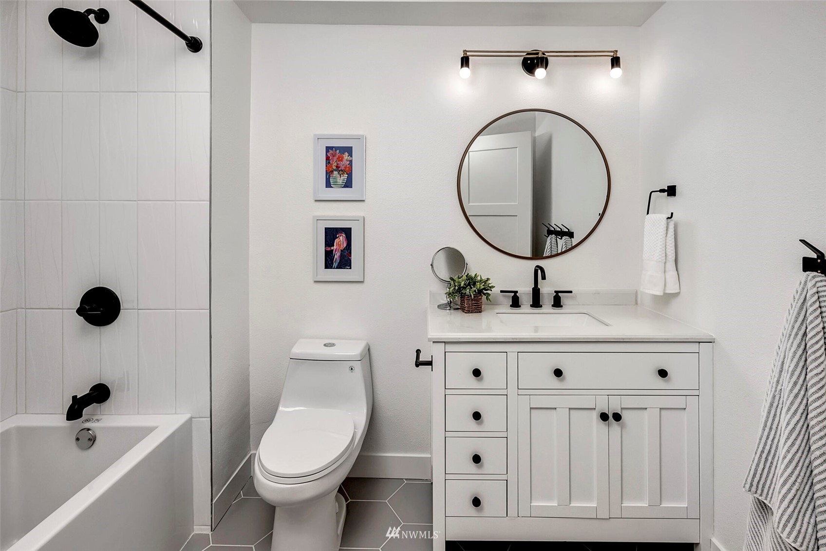 944 26th Avenue Seattle, WA 98122 - Photo 24 of 40 a bathroom with a toilet a sink and a mirror