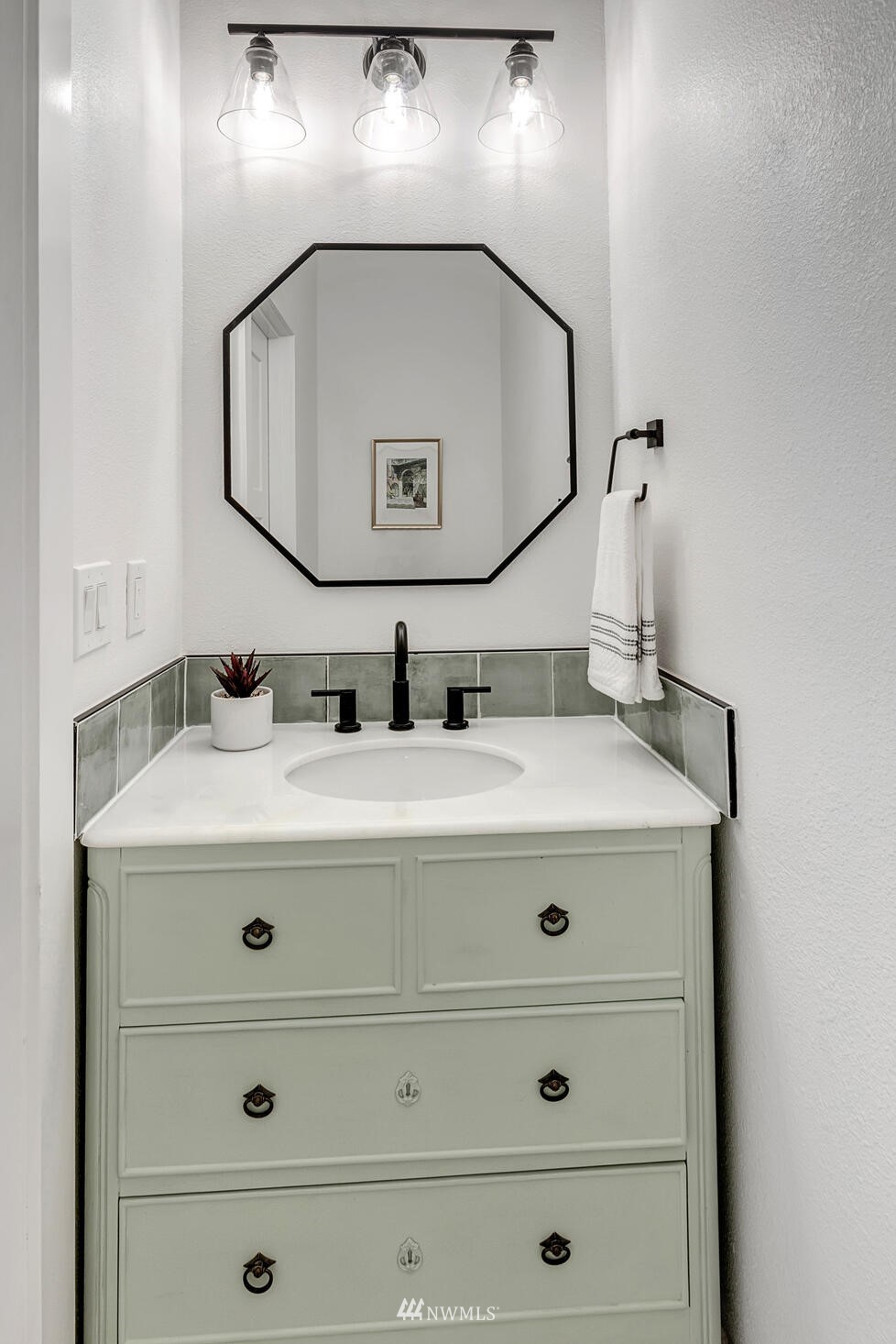 944 26th Avenue Seattle, WA 98122 - Photo 25 of 40 a bathroom with a sink mirror and vanity