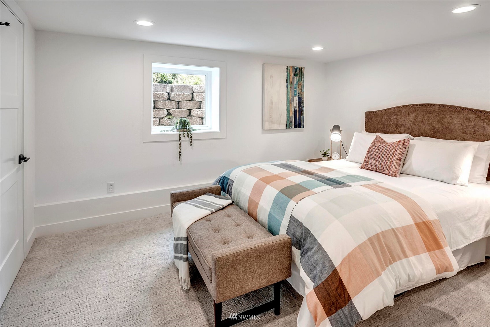 944 26th Avenue Seattle, WA 98122 - Photo 28 of 40 a bedroom with a bed and wooden floor