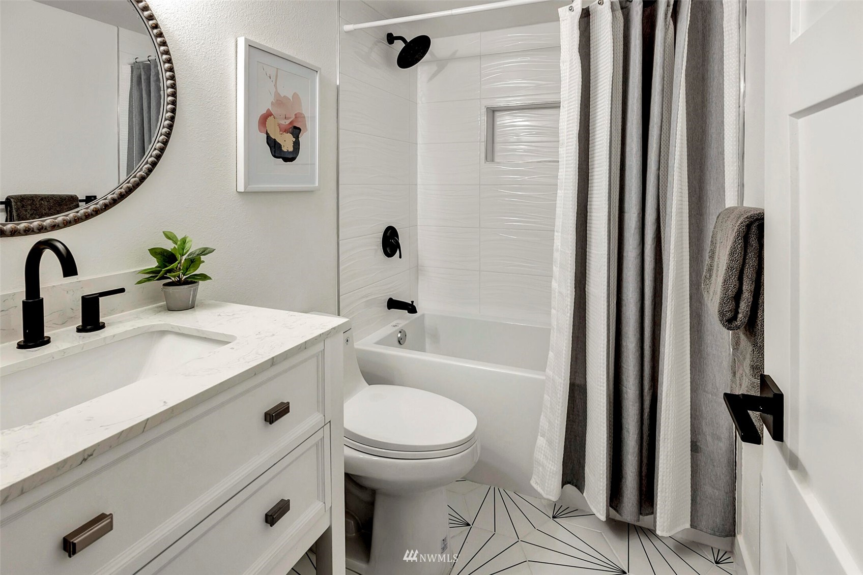 944 26th Avenue Seattle, WA 98122 - Photo 29 of 40 a bathroom with a sink a toilet and a mirror