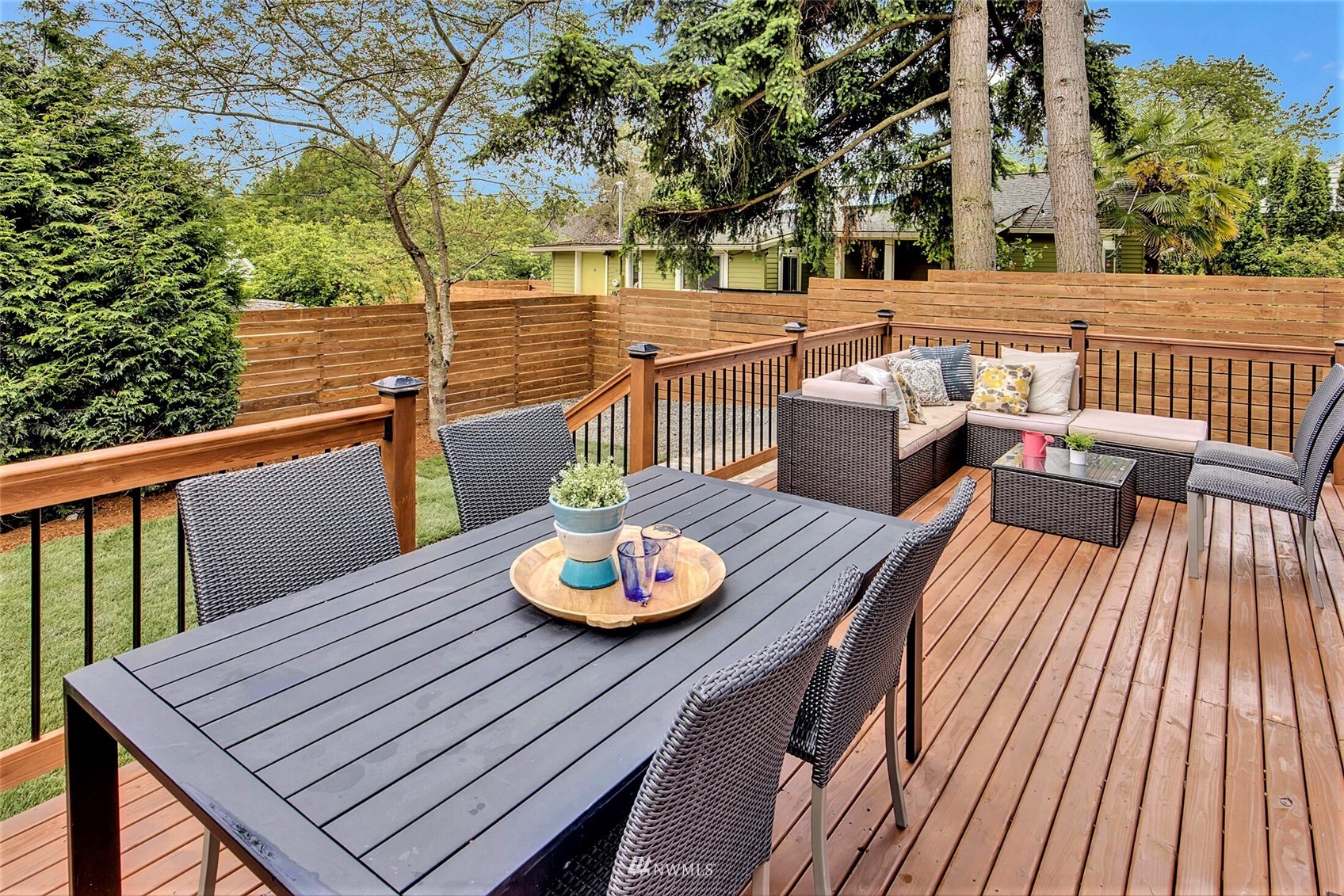 944 26th Avenue Seattle, WA 98122 - Photo 32 of 40 a view of a roof deck with wooden floor and a dining table