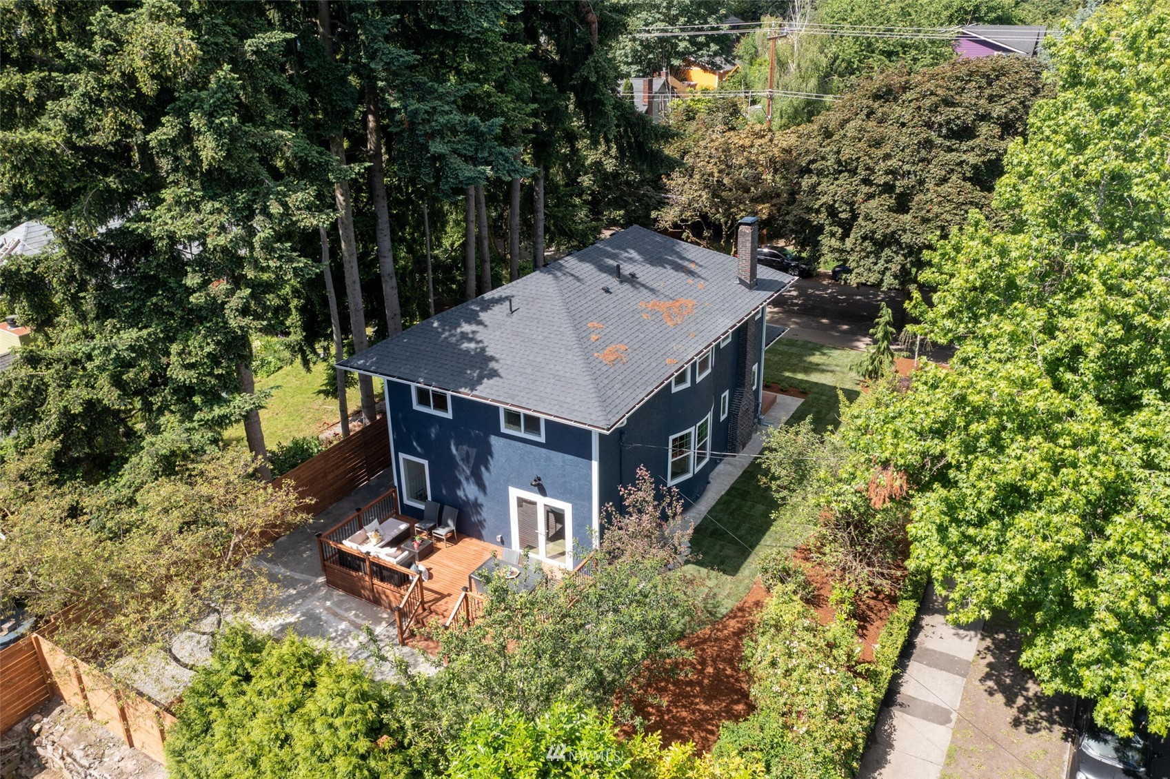 944 26th Avenue Seattle, WA 98122 - Photo 35 of 40 an aerial view of a house with swimming pool and large trees