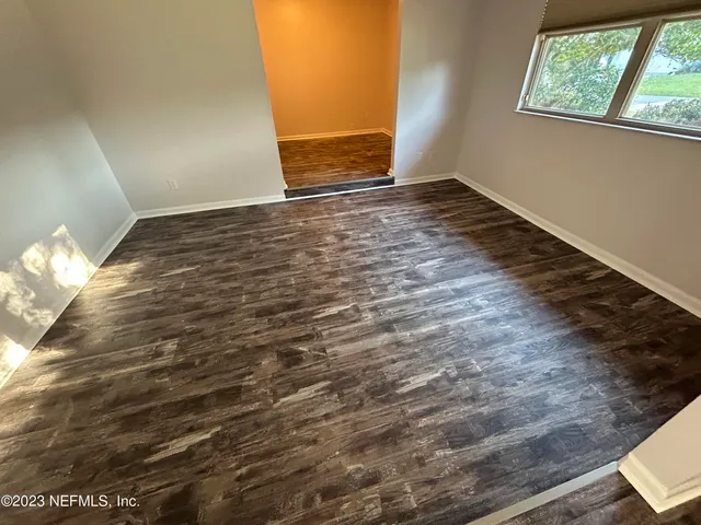 a view of an empty room and window