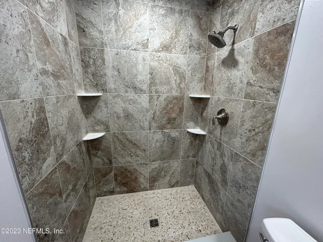 a bathroom with a sink and toilet