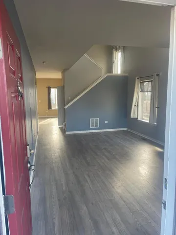 a view of a livingroom with wooden floor