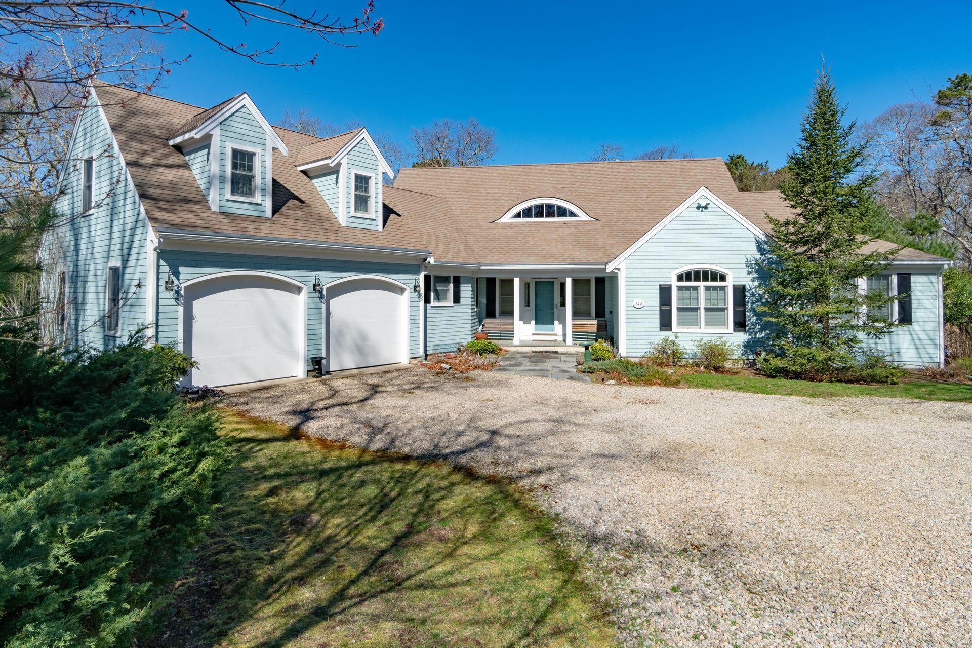 144 Tonset Road Orleans, MA 02653 - Photo 1 of 37 a front view of a house with a yard