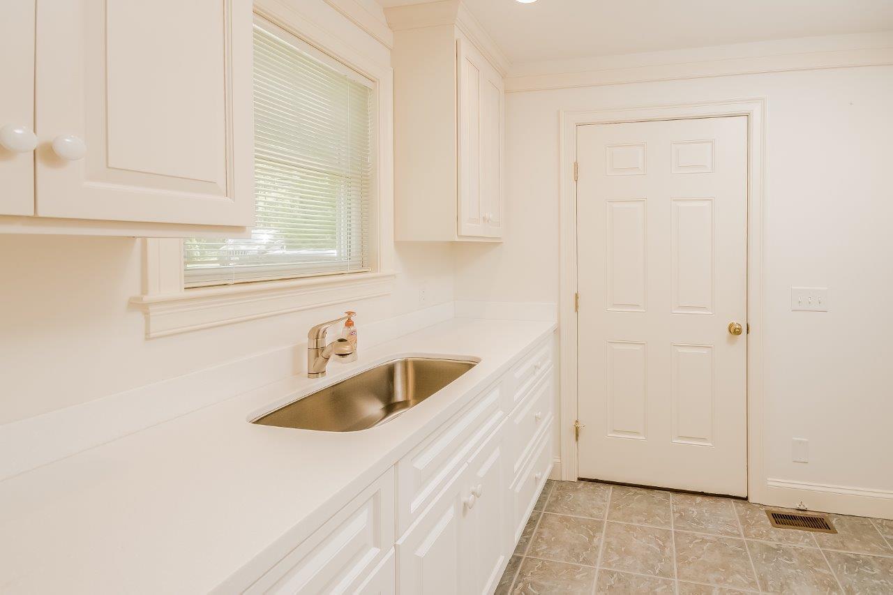 144 Tonset Road Orleans, MA 02653 - Photo 23 of 37 a kitchen with a sink and cabinets