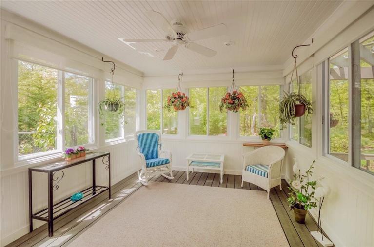 144 Tonset Road Orleans, MA 02653 - Photo 25 of 37 a living room with furniture and a large window