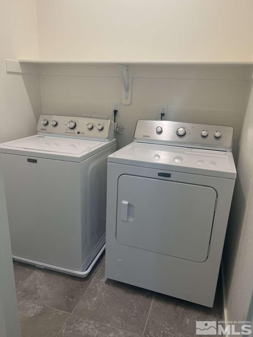 4880 Little Rock Way Sun Valley, NV 89433 - Photo 11 of 30 a utility room with dryer and washer