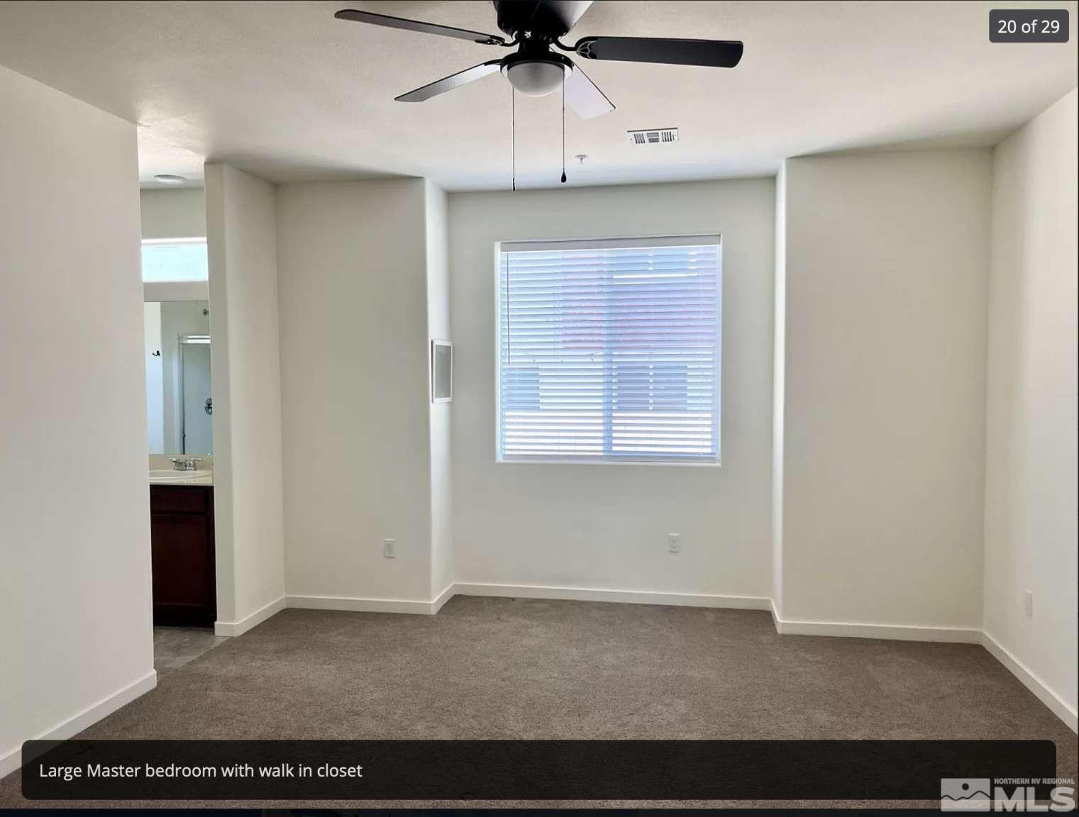 4880 Little Rock Way Sun Valley, NV 89433 - Photo 14 of 30 a view of an empty room with a ceiling fan