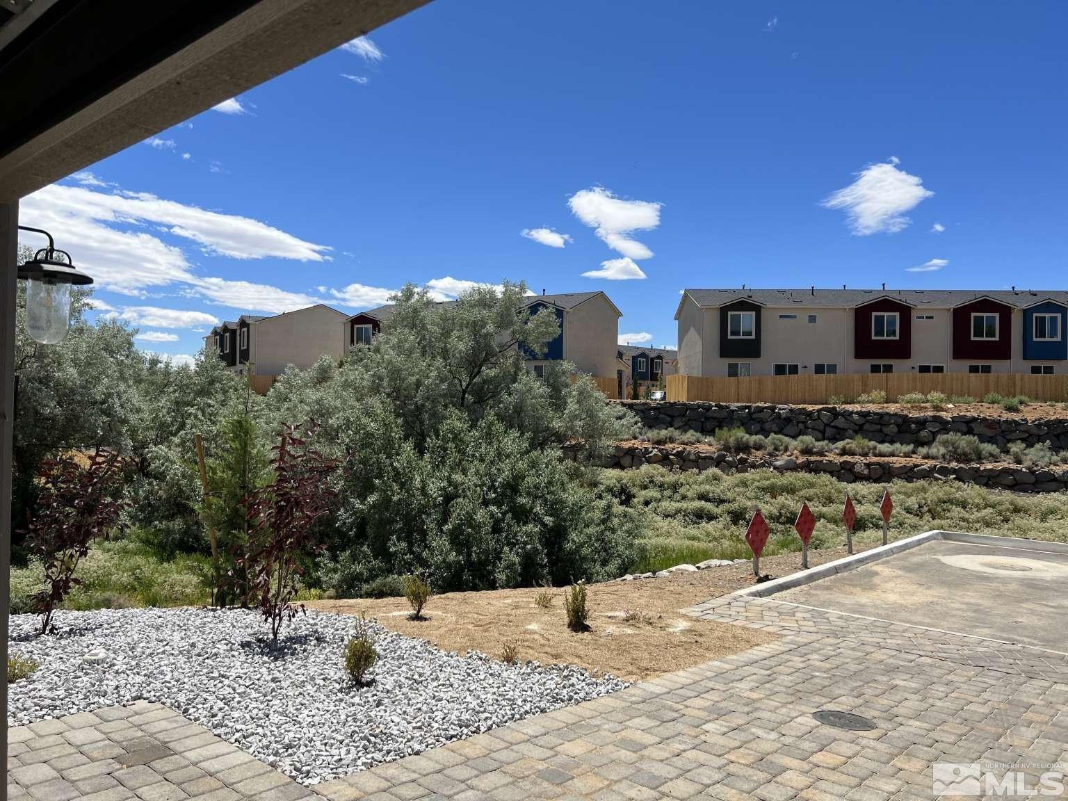 4880 Little Rock Way Sun Valley, NV 89433 - Photo 3 of 30 a view of a house with a yard