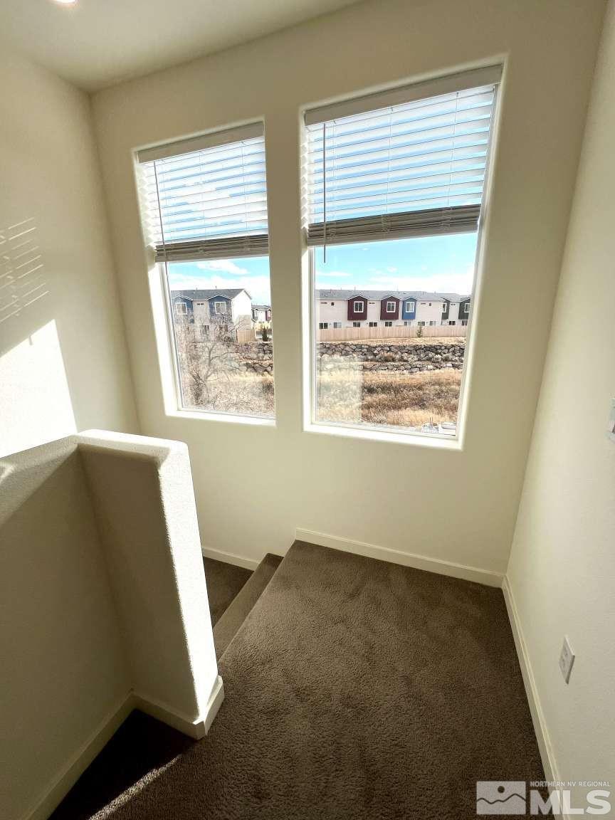 4880 Little Rock Way Sun Valley, NV 89433 - Photo 10 of 30 a view of an empty room with a window