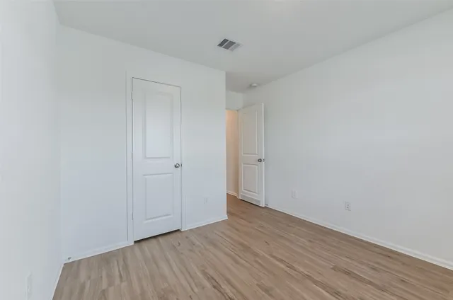 a bathroom with a sink toilet and a mirror