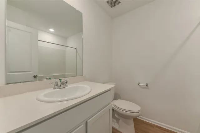 a bathroom with a shower and a toilet